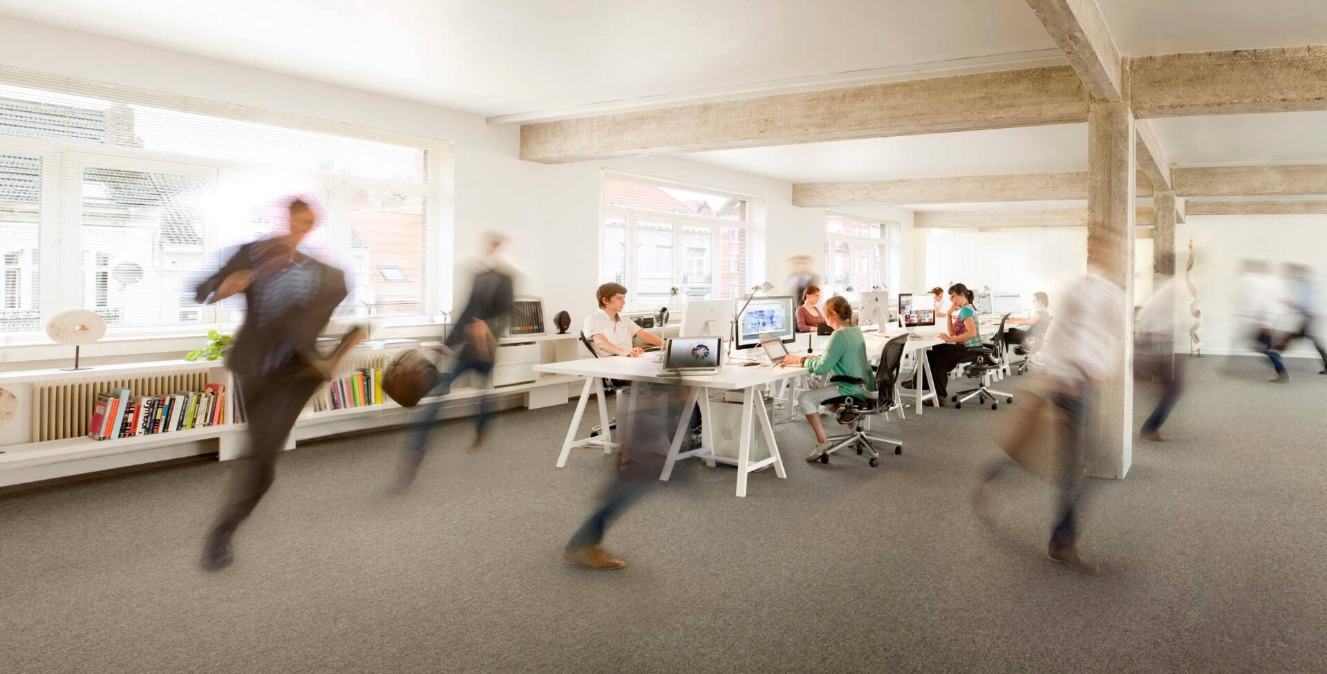 The #inextremis studio in Brussels, with the team in motion around shared desks
