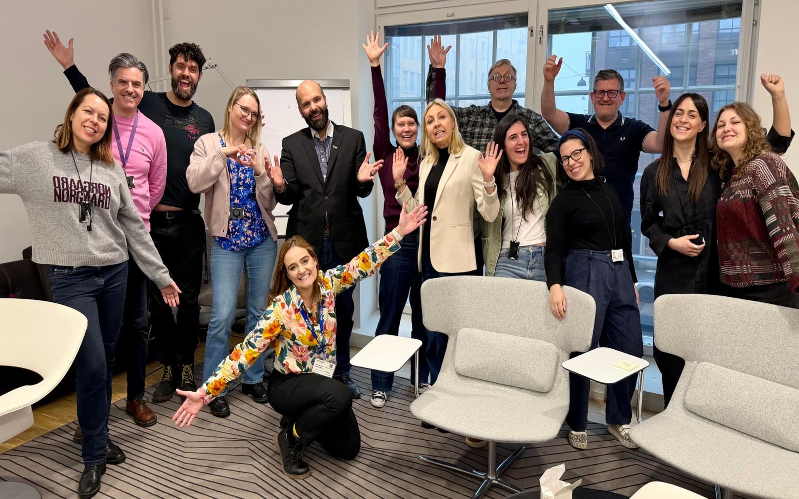 The ECHA communications and leadership group at the end of the branding workshop, celebrating together in their Helsinki meeting room